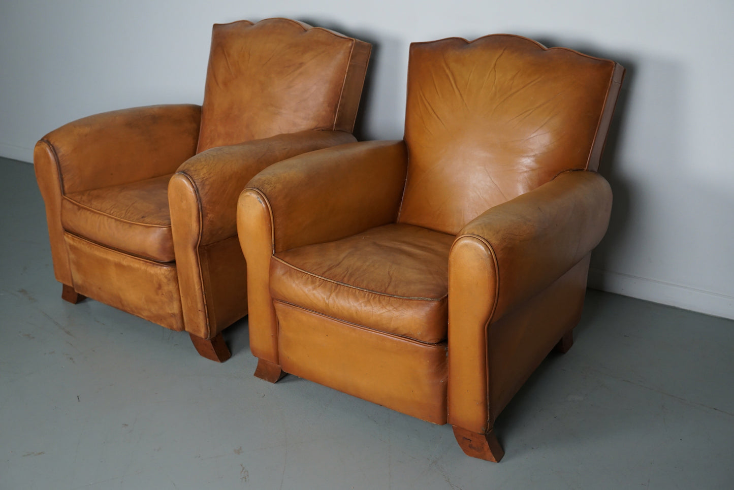 Pair of French Cognac Moustache Back Leather Club Chairs, 1950s