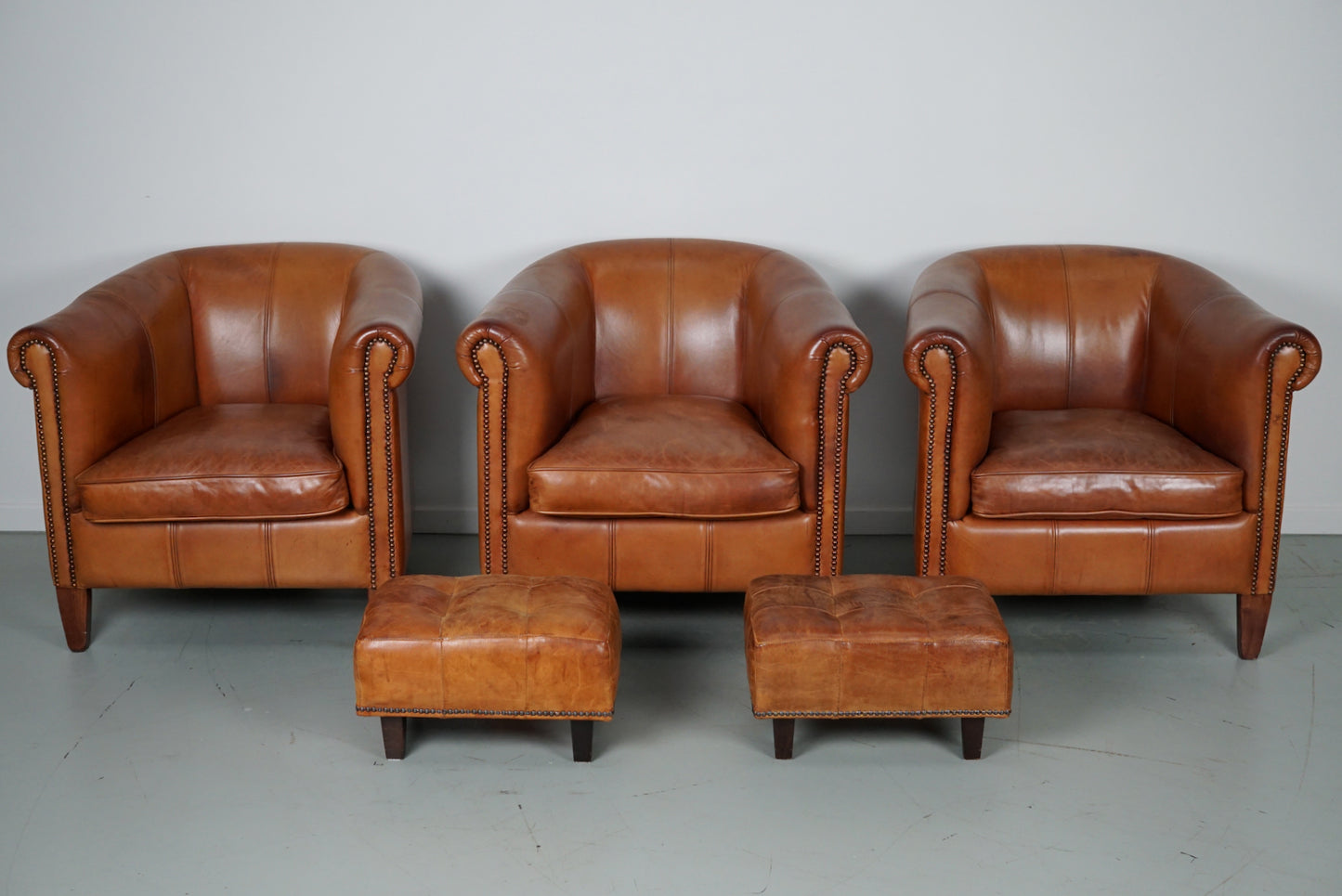 Vintage Dutch Cognac Leather Club Chairs, Set of Three with Two Footstools