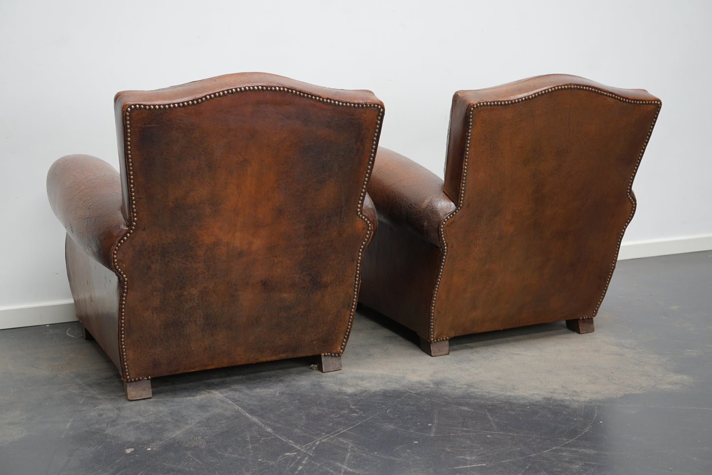 Pair of French Cognac Moustache Back Leather Club Chairs, 1940s