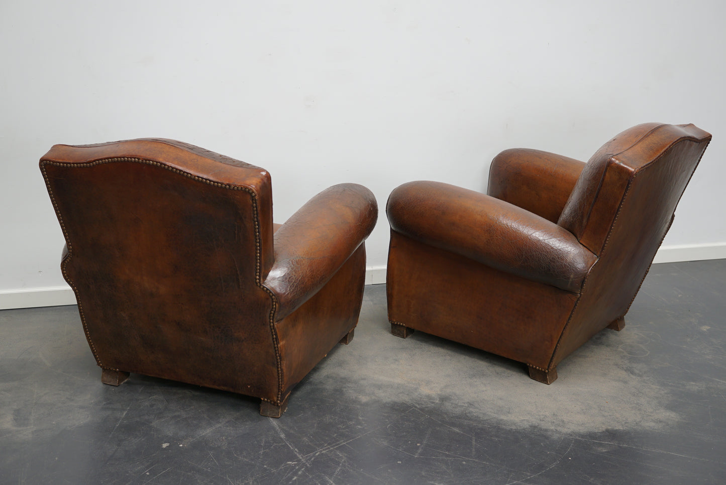 Pair of French Cognac Moustache Back Leather Club Chairs, 1940s