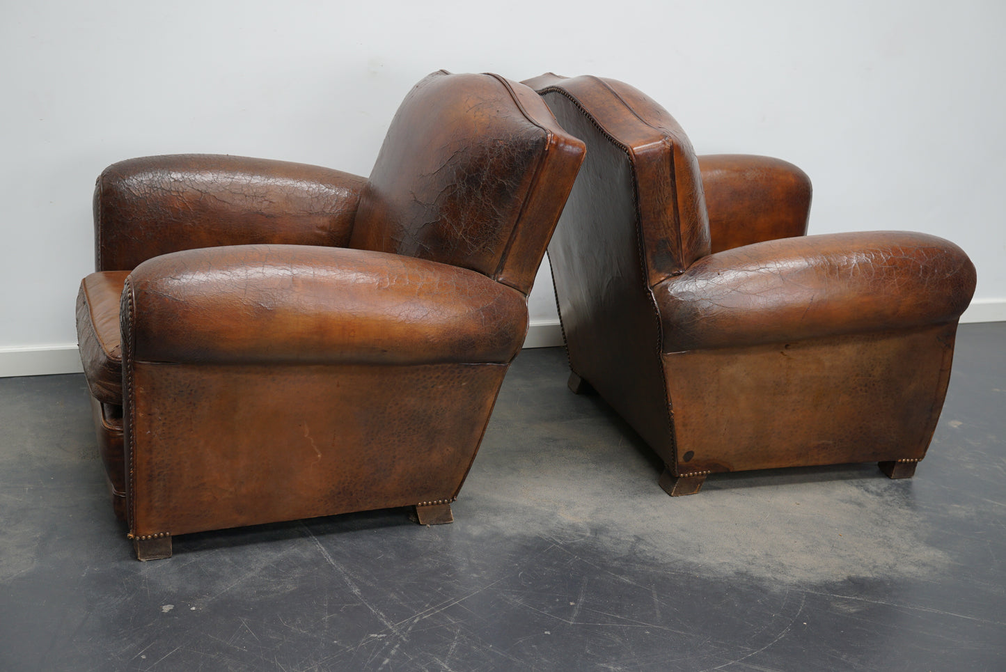 Pair of French Cognac Moustache Back Leather Club Chairs, 1940s