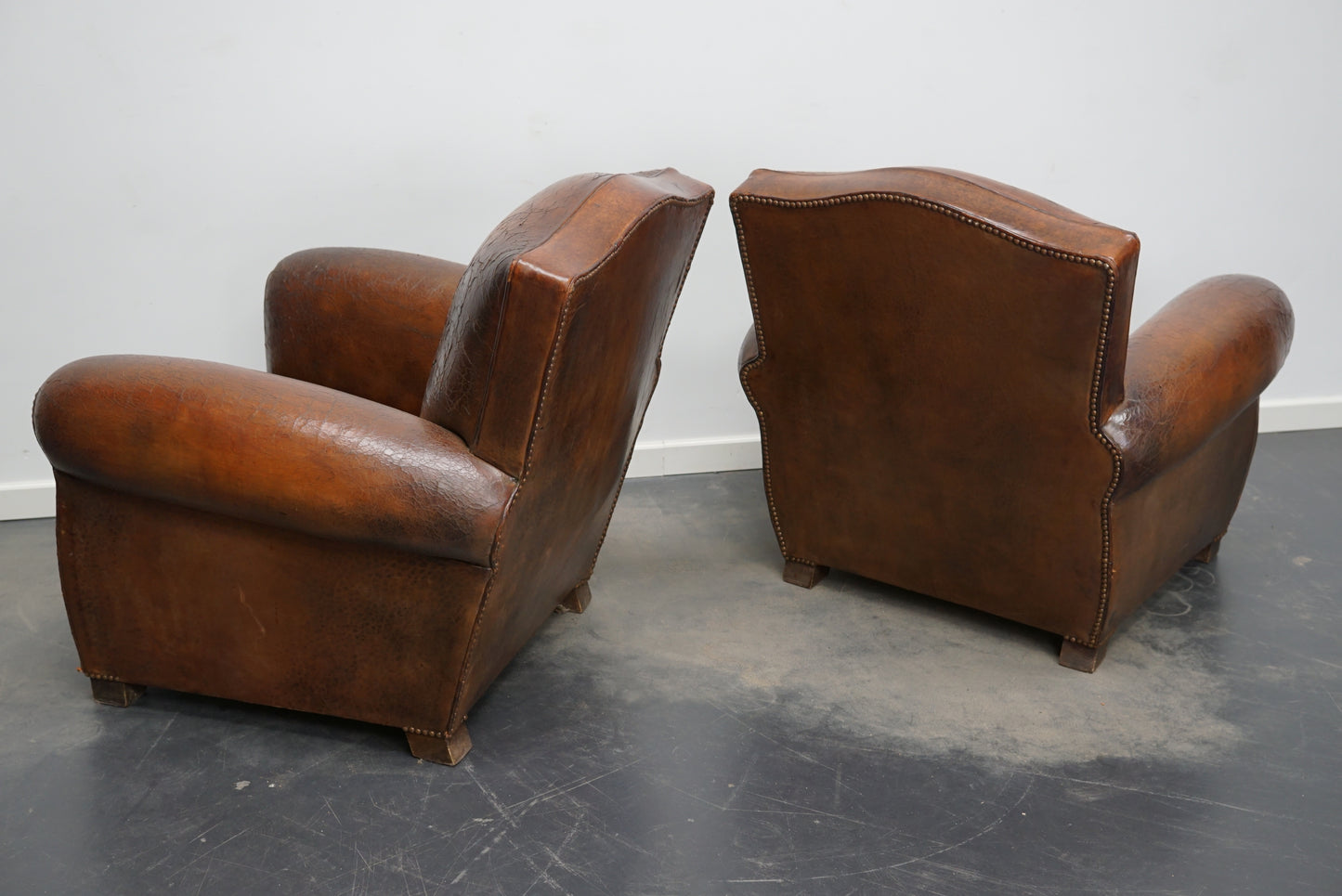 Pair of French Cognac Moustache Back Leather Club Chairs, 1940s