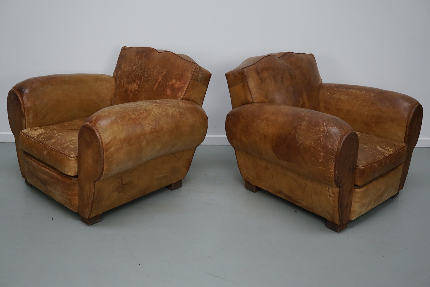 Pair of French Cognac Moustache Back Leather Club Chairs, 1940s