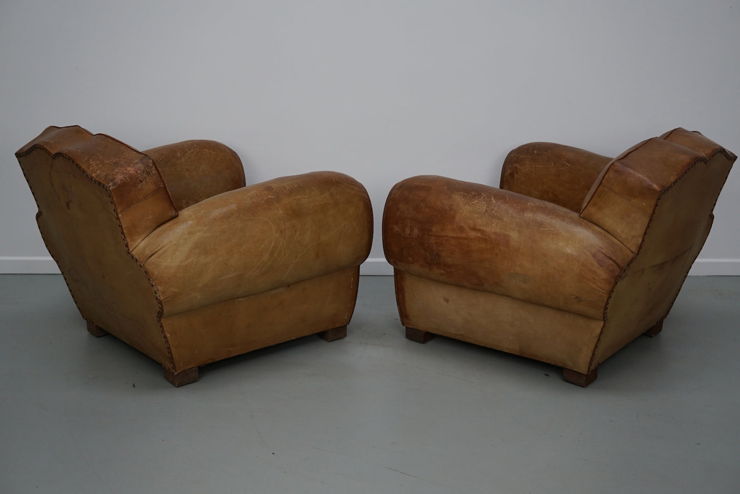 Pair of French Cognac Moustache Back Leather Club Chairs, 1940s