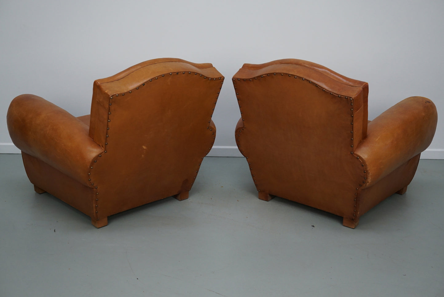 Pair of French Cognac Moustache Back Leather Club Chairs, 1950s
